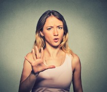 Managing stress and building resilience from the Welbee learning centre. Avoid your stressors - picture of a woman with hand out saying no.