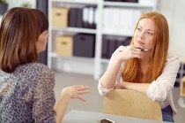 Managing stress and building resilience from the Welbee learning centre. Accept your stressors - picture of a woman expressing her feelings to another.