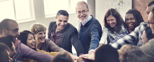 How to achieve high participation from the Welbee learning centre. Picture of a group of staff showing one for all and particpating