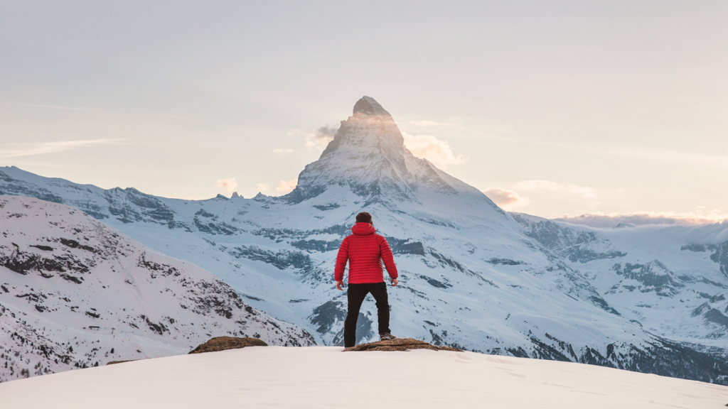 Improve staff wellbeing by setting clear goals - picture of a mountain to climb